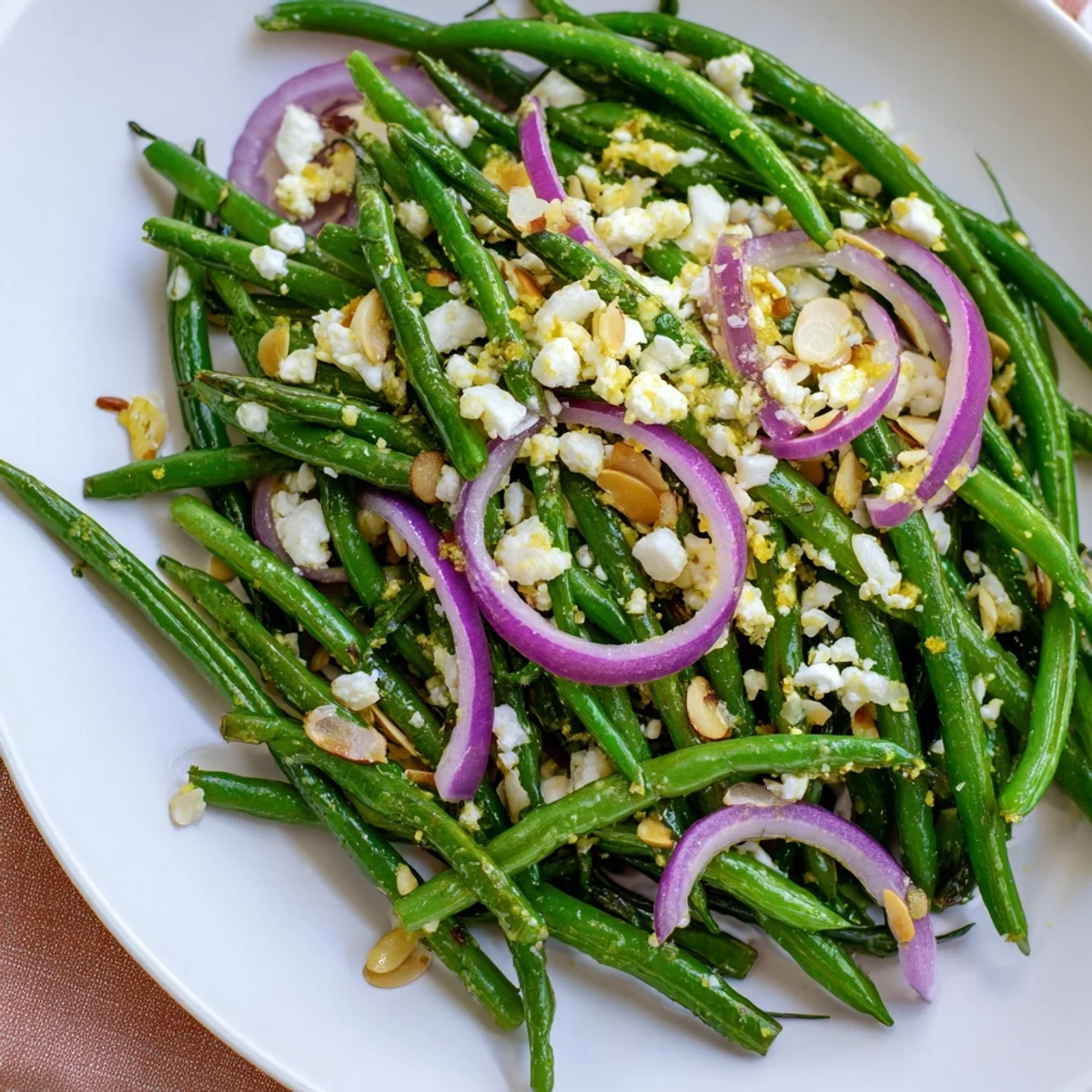 Serve this Green Bean Salad with Feta and Almonds chilled, garnished with fresh herbs, as a light lunch or alongside grilled chicken or fish.
