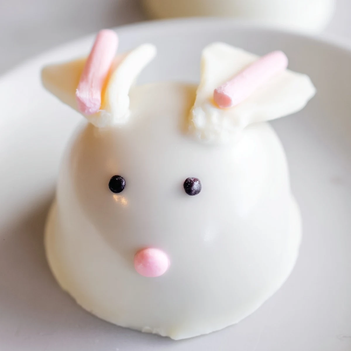 Creamy Oreo truffles shaped like Easter bunnies topped with cute marshmallow ears