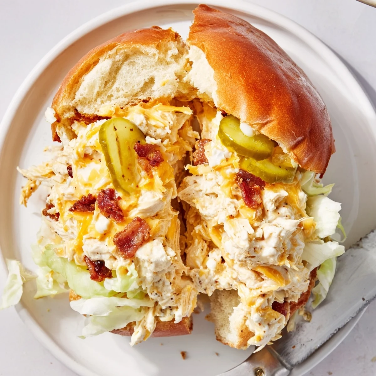Warm Crack Chicken Sandwiches piled with gooey cheese and crispy bacon