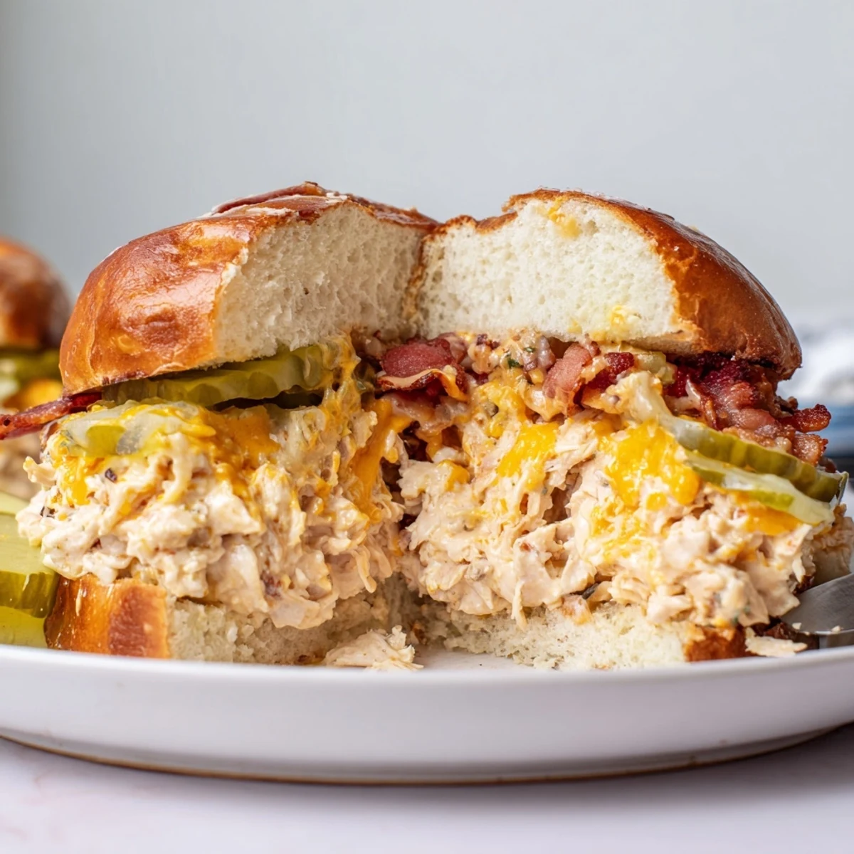Creamy baked Crack Chicken Sandwiches spooned from casserole, perfect with iced tea