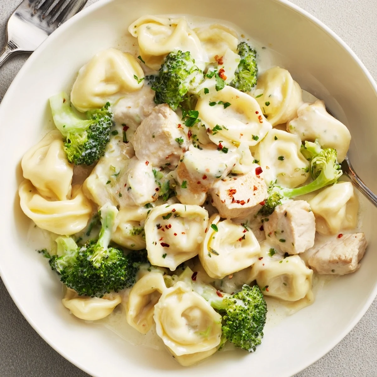 Serve Creamy Garlic Parmesan Tortellini Chicken Broccoli Recipe hot with crusty bread