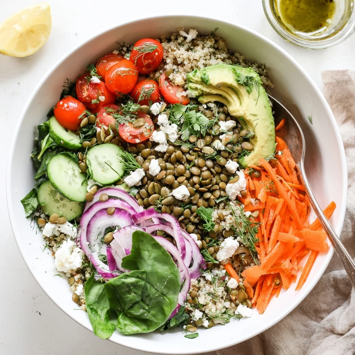 Vibrant lentil grain bowl drizzled with lemon herb dressing over crisp seasonal vegetables