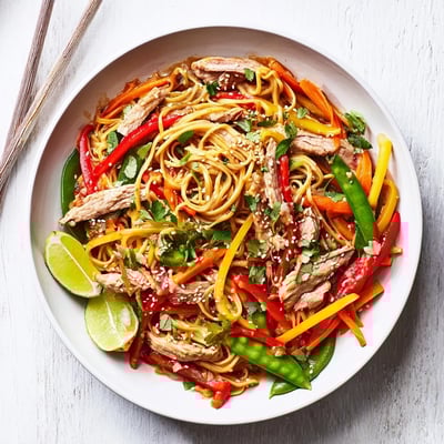 Sweet Chilli Turkey Noodle Stir Fry glistens with saucy noodles, crisp veggies, and golden toasted sesame seeds on top.